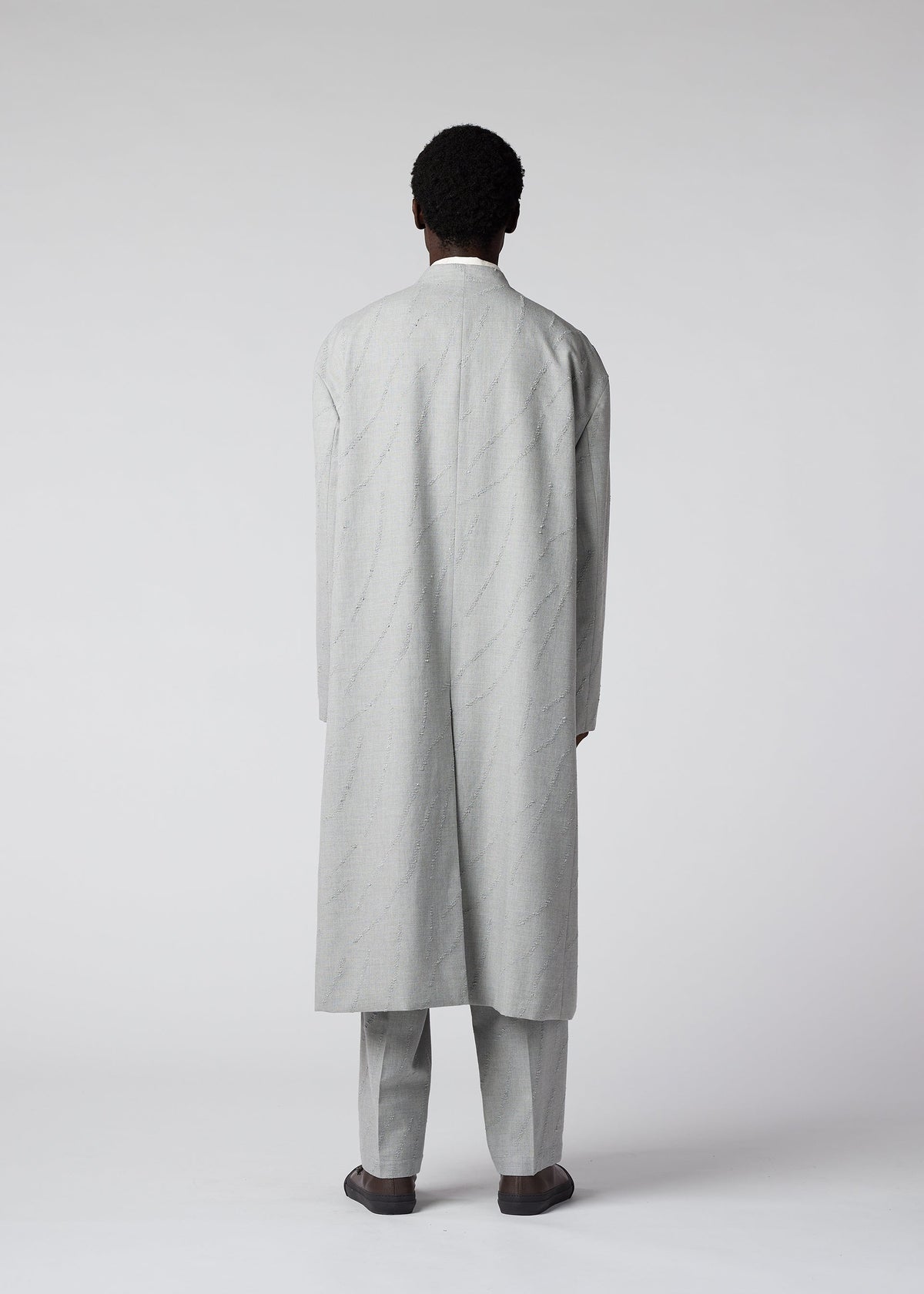 A model wears the IM MEN FLY WOOL coat.