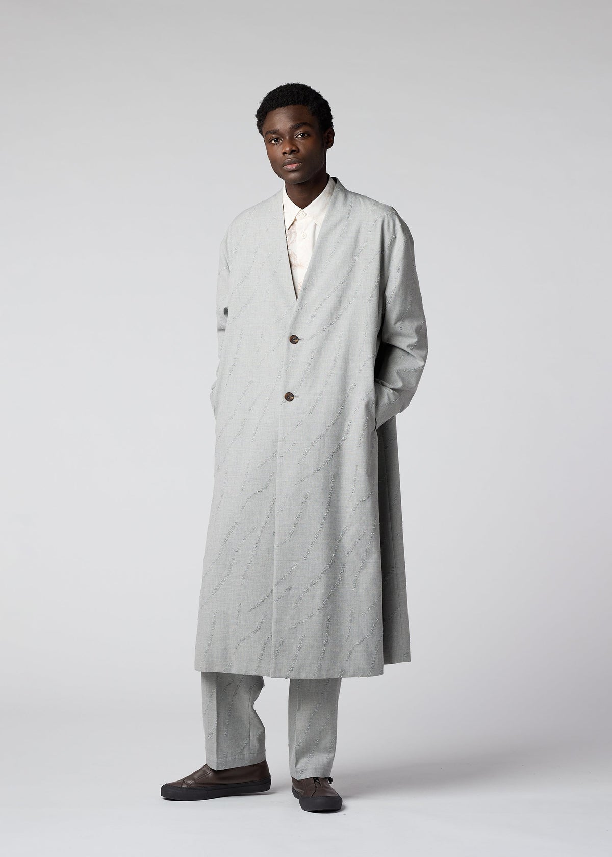 A model wears the IM MEN FLY WOOL coat.