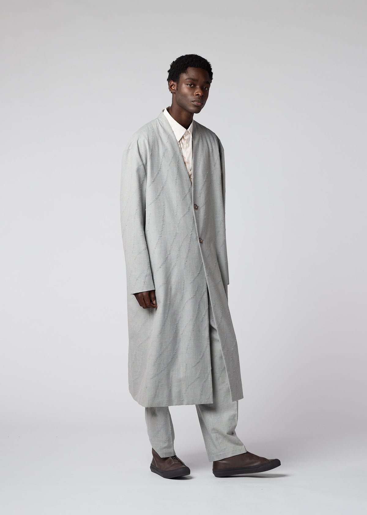 A model wears the IM MEN FLY WOOL coat.