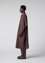 A model wears the IM MEN FLAT clothing.