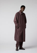 A model wears the IM MEN FLAT clothing.