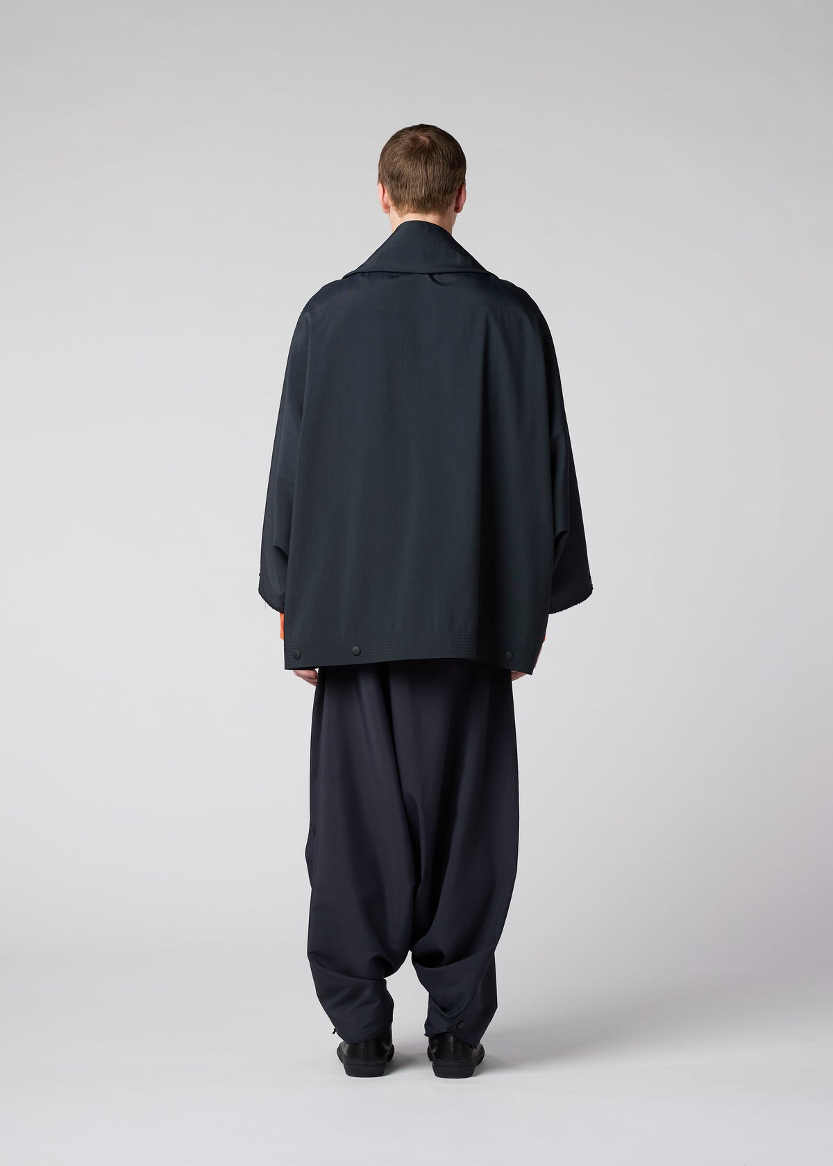 A model wears the IM MEN FLY jacket.