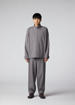 A model wears the IM MEN FLAT clothing.