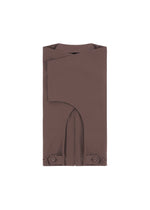 A detail shot of the IM MEN FLAT clothing.