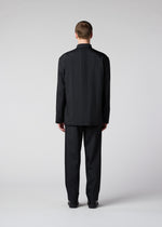 A model wears the IM MEN AIR PLEATS jacket.
