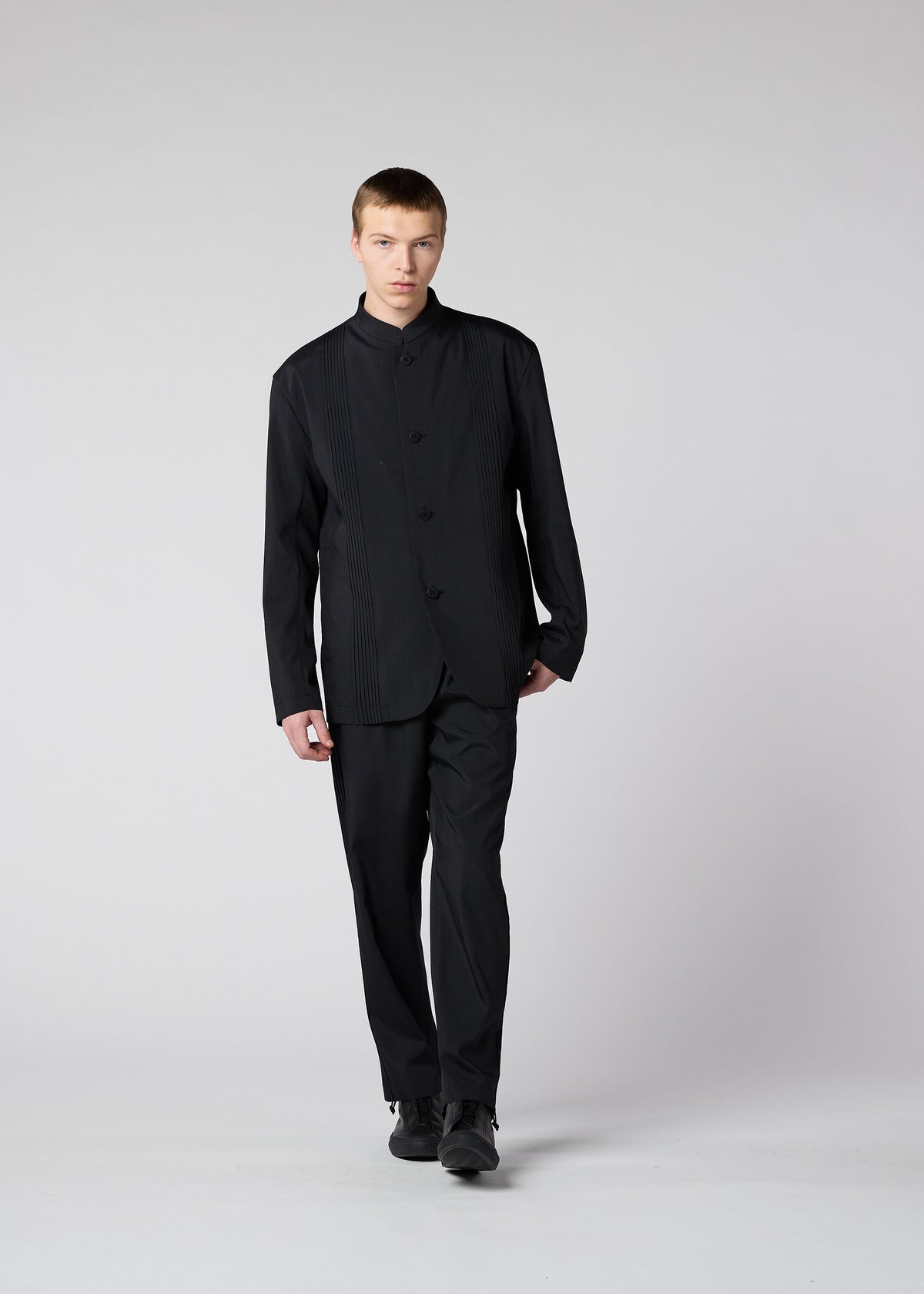 A model wears the IM MEN AIR PLEATS jacket.