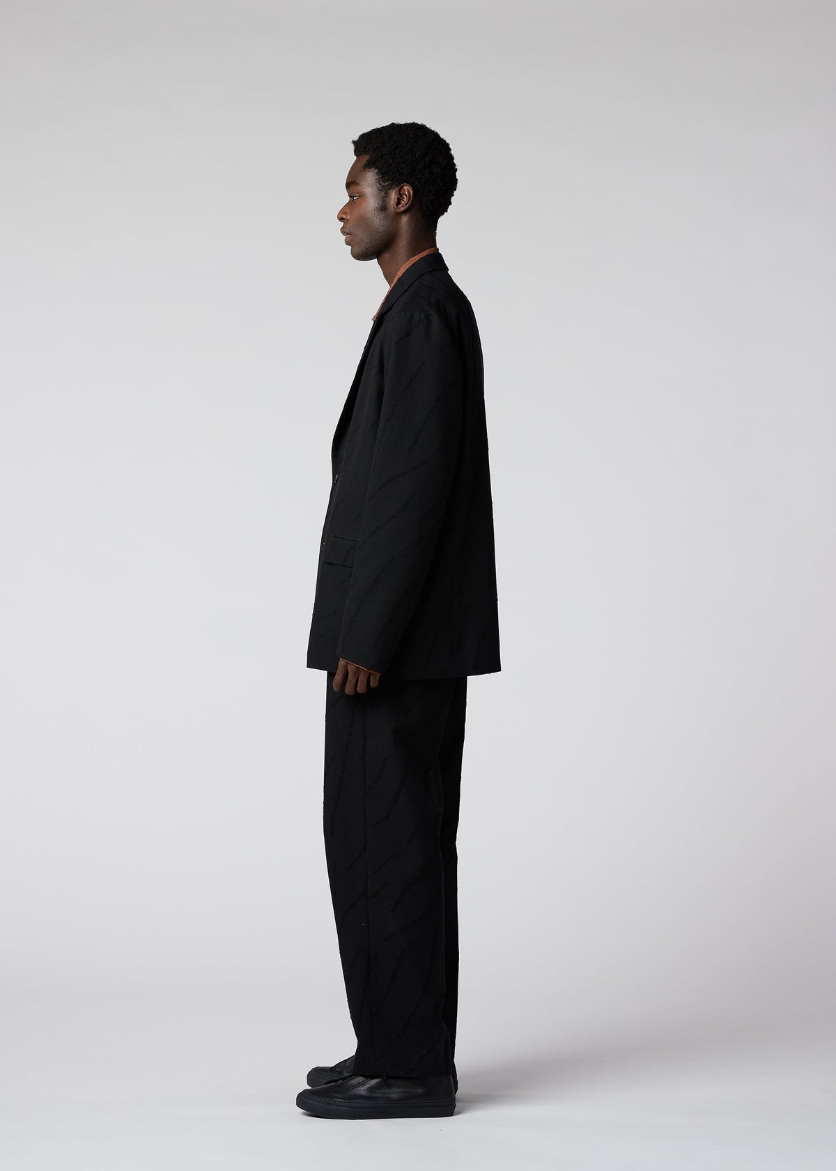 A model wears the IM MEN FLY WOOL jacket.