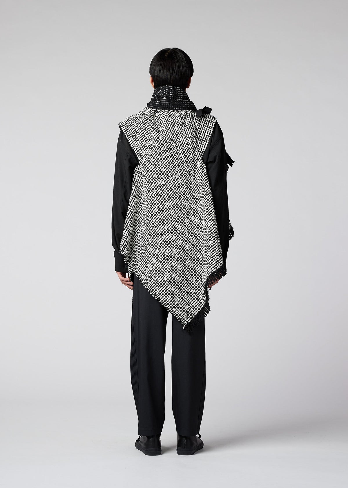 A model wears the IM MEN SAKIORI vest.