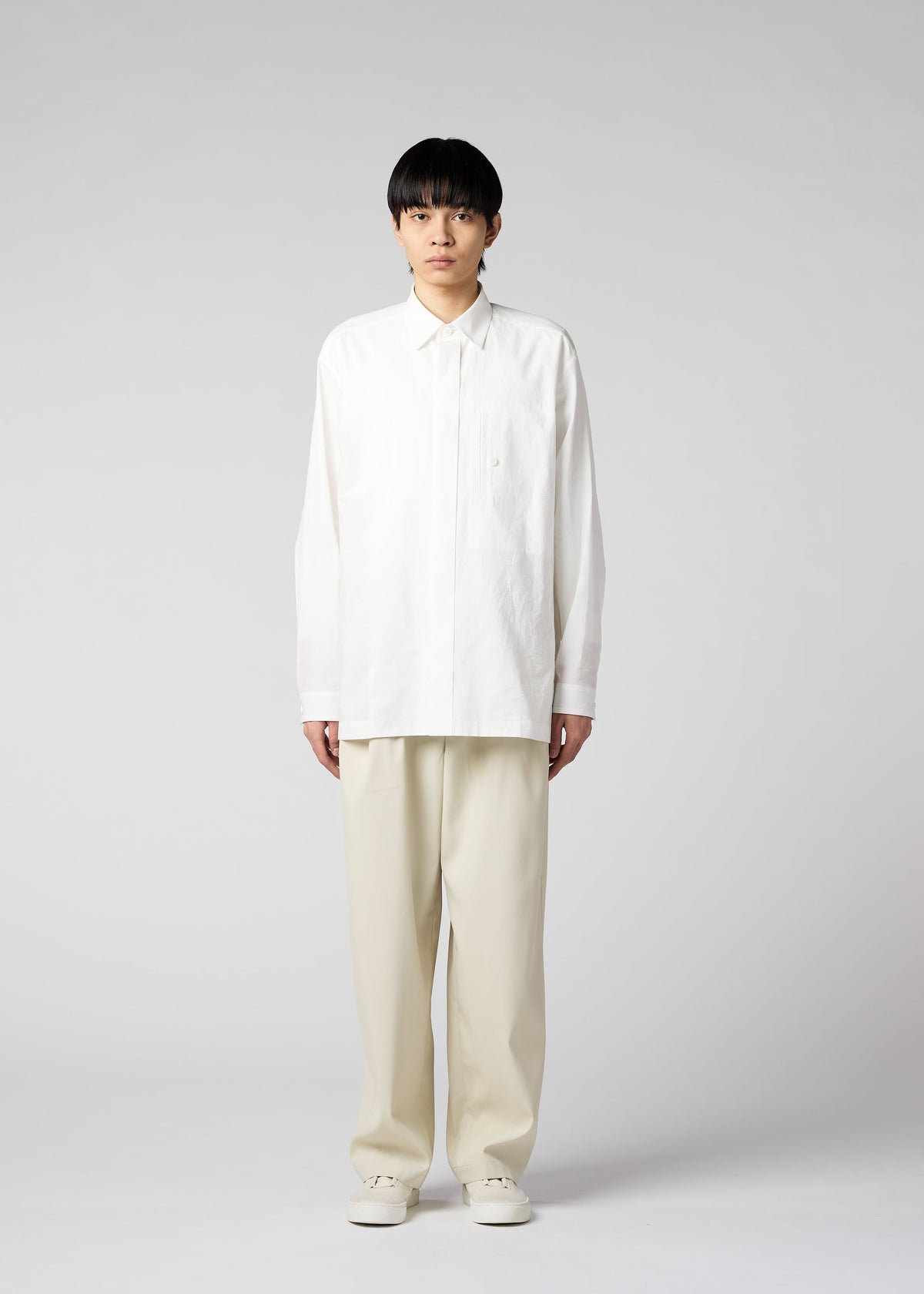 A model wears the IM MEN AIR trousers.