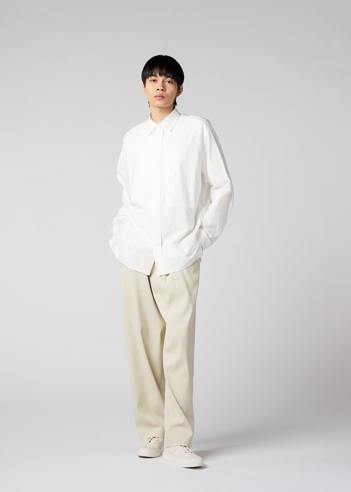 A model wears the IM MEN AIR trousers.