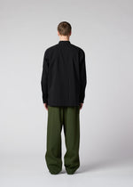 A model wears the IM MEN AIR trousers.