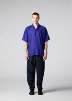A model wears the IM MEN SWING trousers.