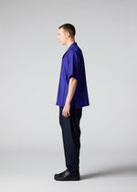 A model wears the IM MEN SWING trousers.
