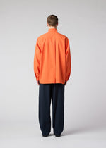 A model wears the IM MEN NAVY BOTTOMS trousers.