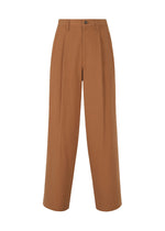 A product shot of the IM MEN NAVY BOTTOMS trousers in terracotta.