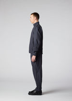A model wears the IM MEN WAFT trousers.