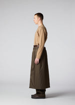 A model wears the IM MEN SWITCH trousers.