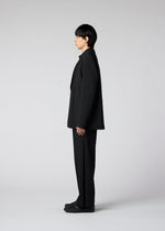 A model wears the IM MEN WINGS trousers.
