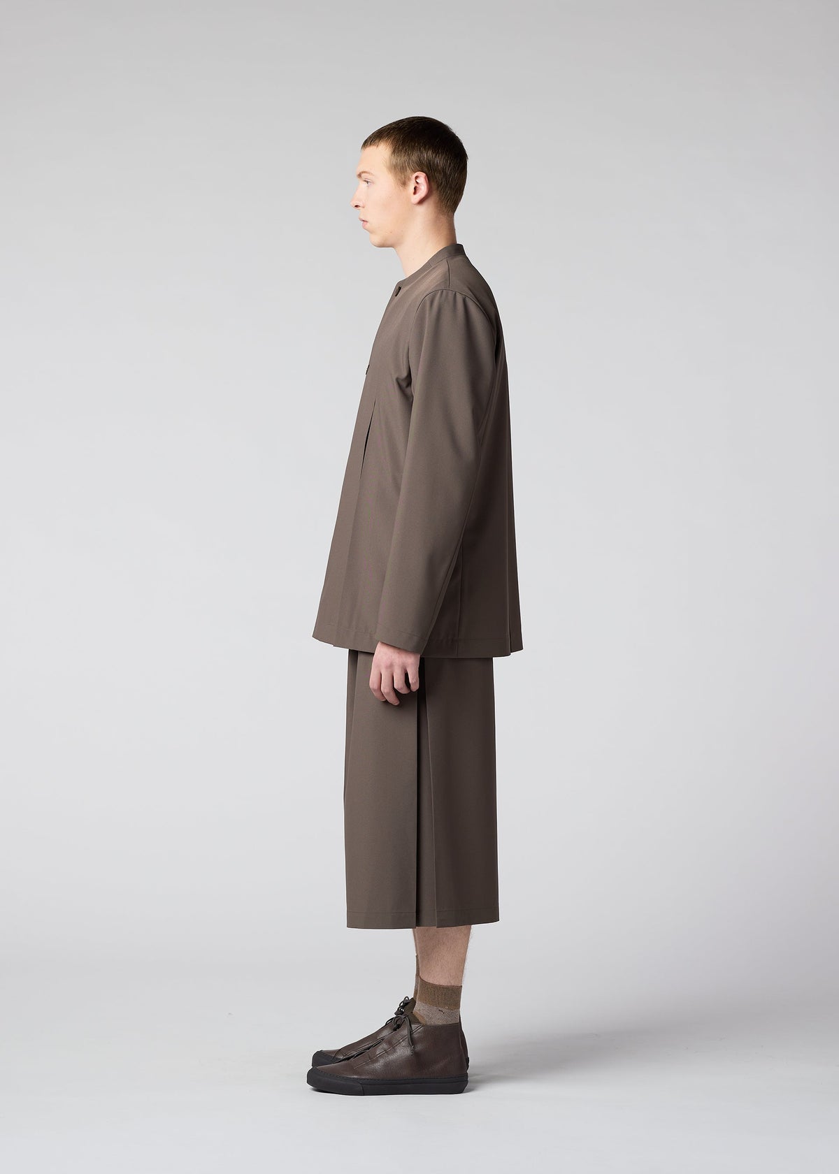 A model wears the IM MEN WINGS trousers.