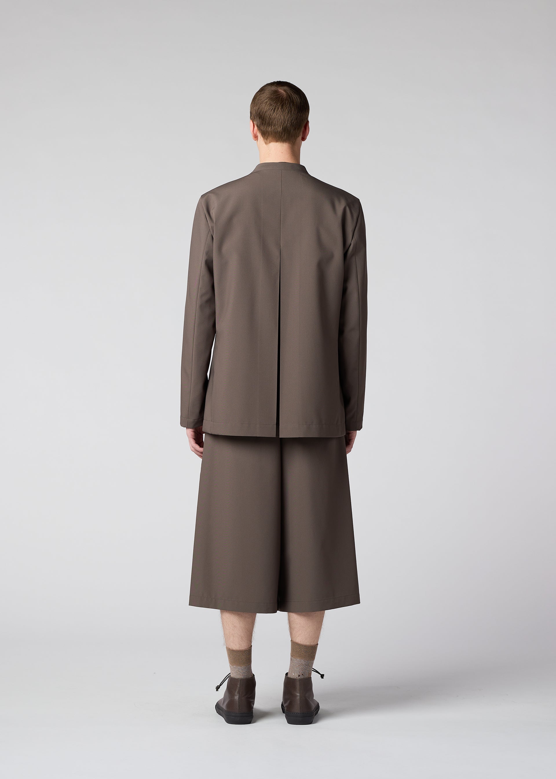 A model wears the IM MEN WINGS trousers.
