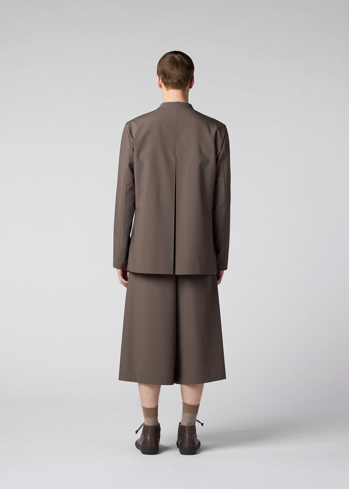 A model wears the IM MEN WINGS trousers.