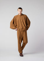 A model wears the IM MEN BREEZE trousers.