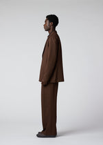 A model wears the IM MEN WOOL LIKE TWEED trousers.