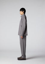 A model wears the IM MEN FLAT clothing.