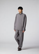 A model wears the IM MEN FLAT clothing.