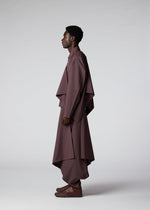 A model wears the IM MEN FLAT DRAPE clothing.