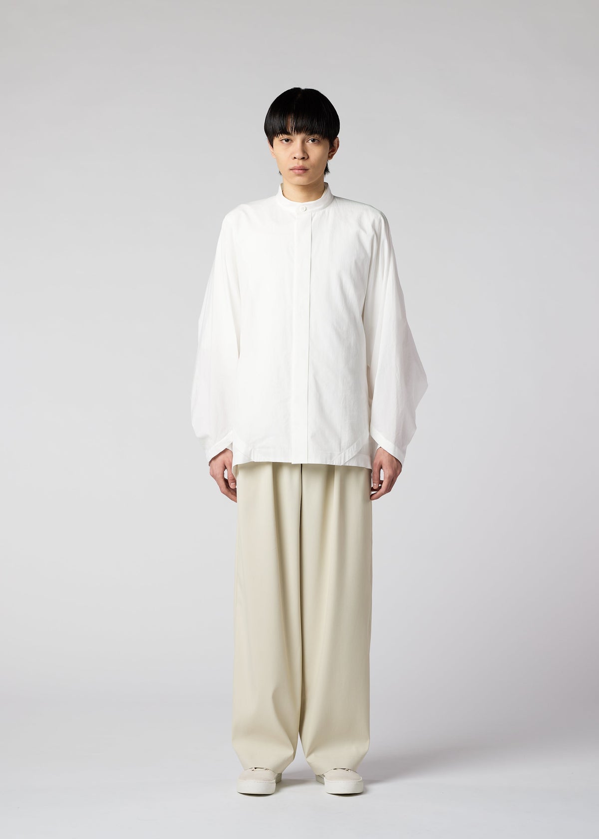 A model wears the IM MEN WHITE SHIRT shirt.
