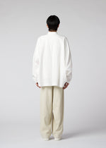 A model wears the IM MEN WHITE SHIRT shirt.