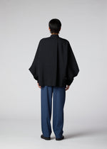 A model wears the IM MEN HYBRID SHIRT shirt.