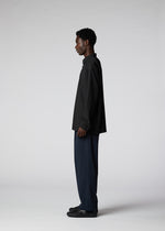 A model wears the IM MEN PLEATS SHIRT shirt.
