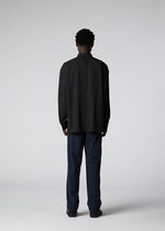 A model wears the IM MEN PLEATS SHIRT shirt.