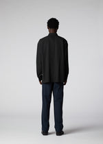 A model wears the IM MEN PLEATS SHIRT shirt.