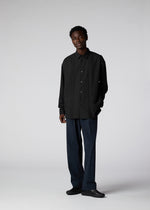 A model wears the IM MEN PLEATS SHIRT shirt.