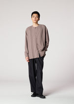 A model wears the IM MEN PLEATS SHIRT shirt.