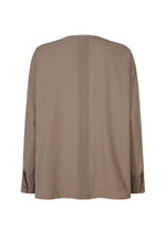 A detail shot of the IM MEN PLEATS SHIRT shirt.