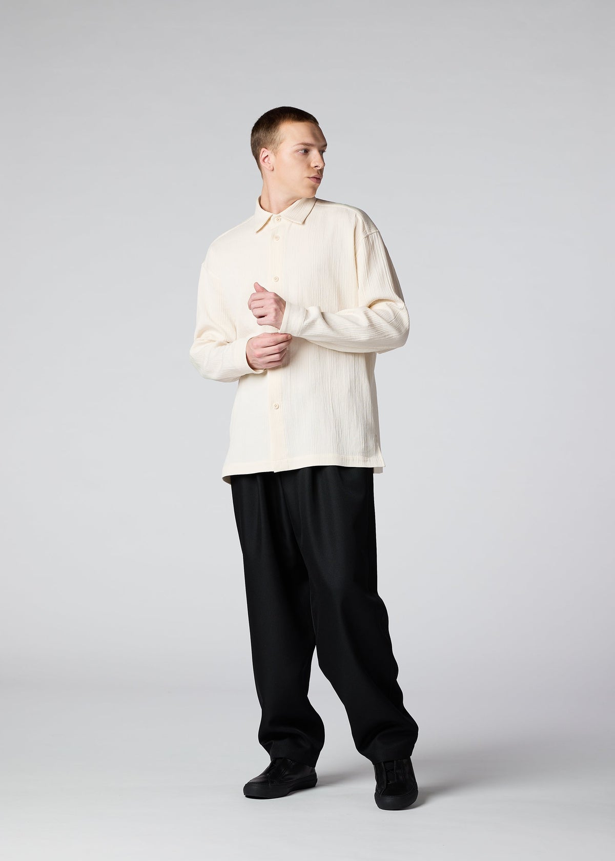 A model wears the IM MEN DOUBLE WEAVE CREPE shirt.