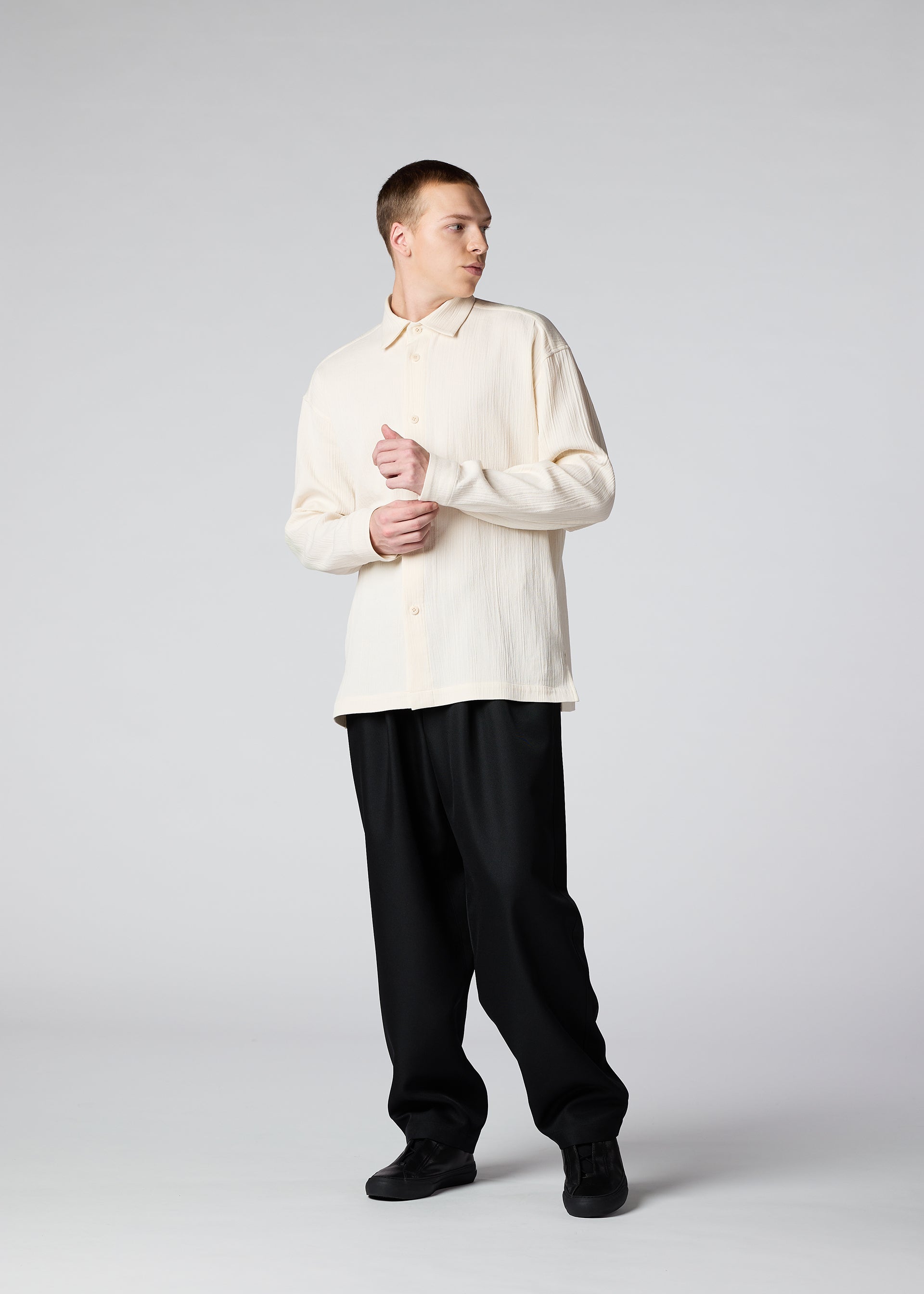 A model wears the IM MEN DOUBLE WEAVE CREPE shirt.