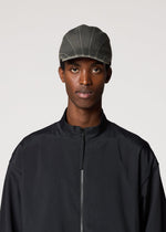 A model wears the IM MEN CARVED CAP hat.