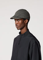 A model wears the IM MEN CARVED CAP hat.