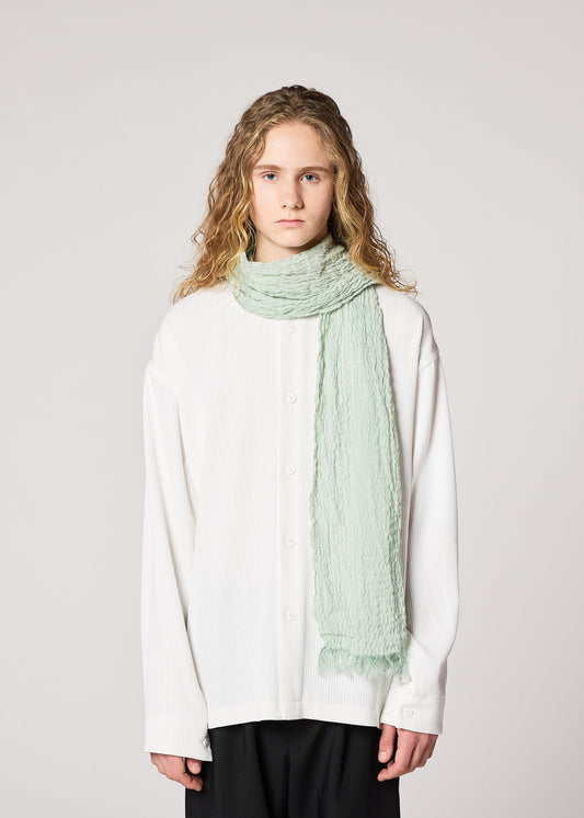 A model wears the IM MEN SHRINK BORDER STOLE stole.