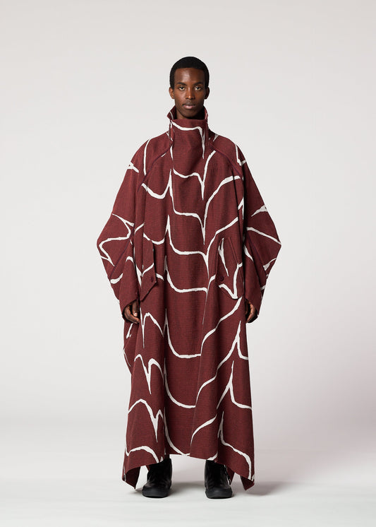 A model wears the IM MEN EARTH coat.