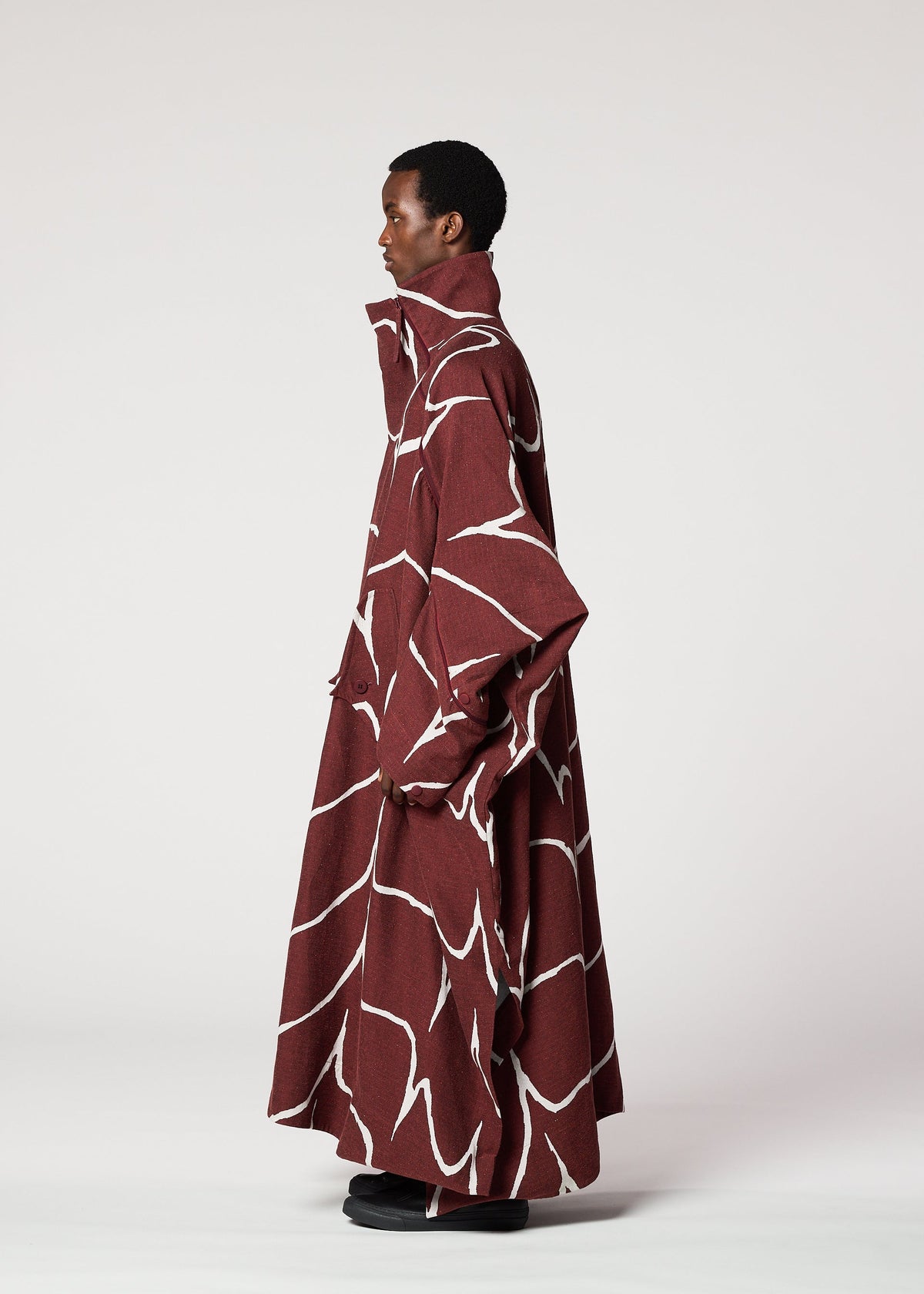 A model wears the IM MEN EARTH coat.