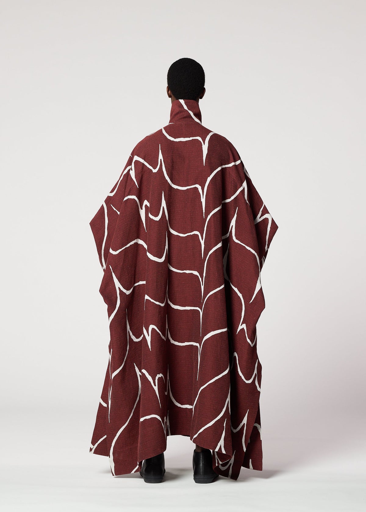 A model wears the IM MEN EARTH coat.