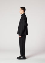 A model wears the IM MEN FLAT BLACK jacket.
