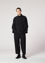 A model wears the IM MEN FLAT BLACK jacket.