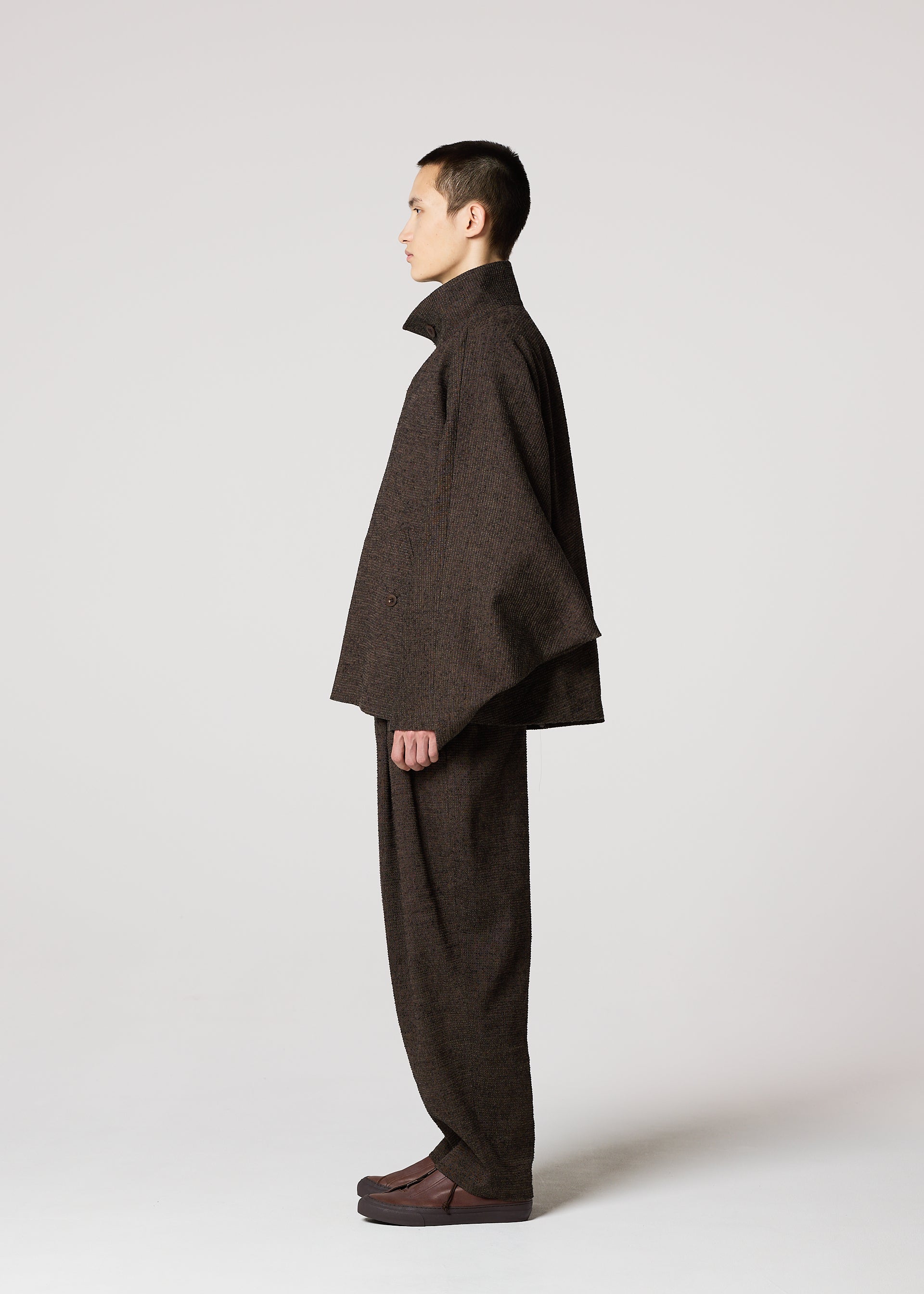 A model wears the IM MEN TEXTURES clothing.